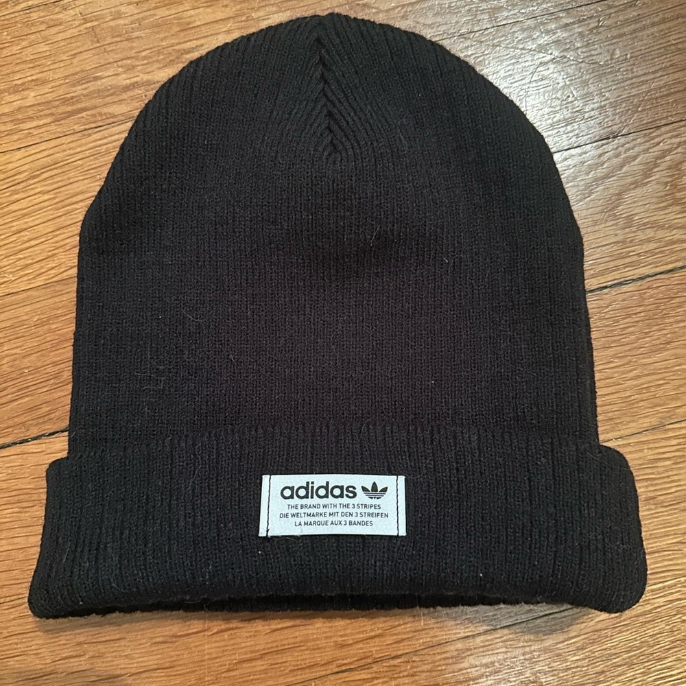 Black Adidas beanie with white label